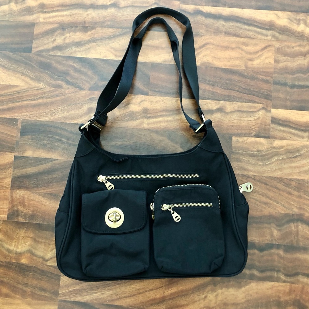 Baggallini black nylon shoulder purse with lots of pockets inside & out.